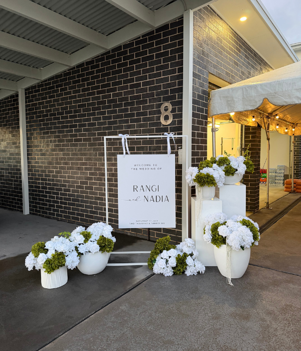 White Welcome Sign Frame with Floral Display