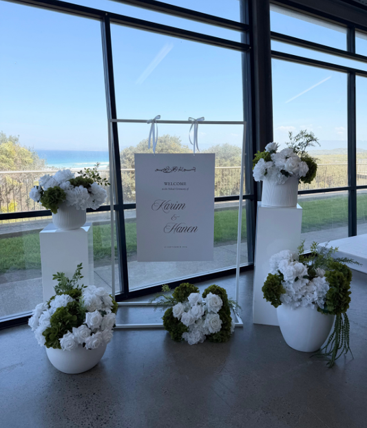 White Welcome Sign Frame with Floral Display